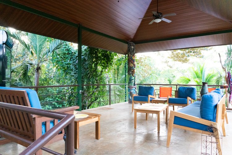 Open-air lounge deck overlooking the rainforest at Arbol Verde
